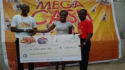 (L-r): Adeeko Adesina, regional manager,(West) Nutricima Limited, Mrs. Otunla Mojisola, N500,000 winner in the Nutricima Mega Cash Promo and Sunday Olaoluwa, sales supervisor, West, Nutricima Limited during the cheque presentation to winners at the final phase of Nutricima Mega Cash Promo Prize Presentation in Ibadan, recently.